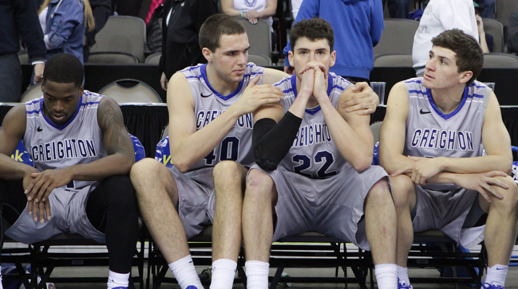 Zach Hanson (center) consoles an inconsolable Avery Dingman and Austin Chatman after another heartbreaking loss.