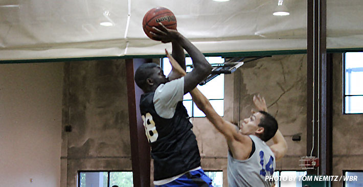 Khyri Thomas shoots with a hand literally in his face. (Photo by Tom Nemitz / WBR)